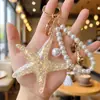 Llavero Pulsera Personalizada de Perlas y Estrella de Mar Estilo Verano Océano Colgante de Estrella de Mar de Resina AliExpress Regalos Pequeños Transfronterizos