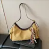 Bolso bandolera retro de nicho coreano tipo bolsa de albóndiga para mujer Otoño 2025 Nuevo Bolso de hombro cruzado moderno y simple de alta gama
