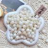 Cuentas sueltas de raíz de bodhi de piel de flor natural, hechas a mano, fruta original, accesorios de cuerda de mano, juego literario femenino, cuentas de rosario, venta al por mayor de fábrica