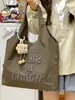 Bolsa de Lona Casual para Mujer 2025 Nueva Moda Ligera para Llevar en la Mano Bolsa de Compras Versátil Bolso de Hombro para Viajar al Trabajo