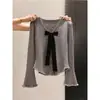 Top de punto de manga larga con diseño único de corbata de moño para mujer, moda de otoño e invierno, botones en forma de corazón, top versátil y chic