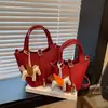 Bolso de Mano Pequeño con Patrón de Lichi Transfronterizo Primavera 2026 Nuevo de Moda Casual Cubo Versátil Bolso de Hombro Cruzado