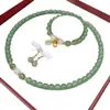 Explosiones en Vivo Cuentas Redondas de Vidrio Collar Moda Combinable Jade Dongling Conjunto de Tres Piezas Joyería Joyería de Estilo Nacional de Alta Gama Mujeres