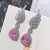 Venta caliente en línea de celebridades en vivo, pendientes de botón de lujo ligeros y románticos de piedra Morgan rosa Argyle con microincrustaciones de gota de agua y diamantes rosas con alas para mujer