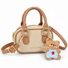 Bolsa Infantil Ligera Mini Unisex Bolsa de Bolos para Niños Estilo Coreano Bloque de Color de Moda Accesorio con Colgante de Oso Lindo Bolsa