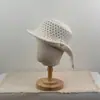 Nuevo sombrero de pescador de punto calado vintage para mujer, elegante y que adelgaza la cara, con decoración de perlas, versátil y elegante