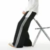 Calça Casual Listrada Contrastante Estilo Americano para Homens Nova Primavera Calça de Moletom Esportiva Americana Perna Larga Reta Solta Calça Longa para Homens