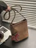 Bolso Retro de Estampado de Leopardo de Gran Capacidad para Mujer Otoño e Invierno 2025 Nuevo Bolso de Hombro de Moda Bolso Cubo de Textura de Alta Calidad