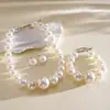 Collar de tres piezas vintage europeo y americano con cuentas de perlas, cadena para la clavícula de nicho de alta gama, accesorio femenino simple y elegante