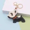Pingente de Cachorro Ins Maluco Desenho Animado Cachorro Balançando Pingente de Couro Bolsa de Couro PU Artesanal Pingente Chaveiro de Carro