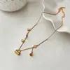 Collar con colgante de bolsa de filigrana fructífera chapado en oro de 18 quilates antiguo, borla, florecilla, cadena para la clavícula de lujo ligero de alta gama