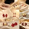 Aretes Geométricos Rojos Ankela Festivos de Año Nuevo Nicho Temperamento Venta Caliente Aretes de Botón Otoño/Invierno 2026 Venta al por Mayor de Pendientes