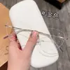 Populares en Xiaohongshu, montura de titanio ultraligera sin montura para mujer 20207, pura y delicada, que estiliza el rostro, venta al por mayor de fábrica, lentes con forma de mariposa