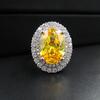 Fábrica de joyería Zhuang Sheng al por mayor anillo abierto de diamante amarillo imitación Dan de paloma de colores incrustado micro incrustado anillo para mujer