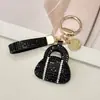 Llavero de bolso tipo sobre de diamantes completos transfronterizo, piel, alta gama, tachonado de diamantes, accesorio de bolso de lujo ligero para mujer, pequeño regalo