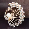 Broche de aleación de diamante de pavo real retro europeo y americano para mujer, corsage de traje de alta gama versátil, accesorios creativos para pines de ropa