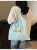 Bolso de Hombro Transfronterizo Nuevo Estilo 2026 Gran Capacidad con Estampado de Letras para Mujer, Bolso de Compras Fresco y Sencillo, Bolso de Tela Versátil para Mujer