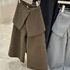 Pantalones de otoño e invierno para niñas 2026 nuevos pantalones largos gruesos con forro polar estilo coreano de pierna ancha pantalones de traje para niños casual