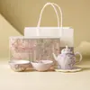 Conjunto de Chá Kung Fu Cerâmico com Camélia e Glicínia Pintado à Mão do Fabricante, Especificamente para Infusão de Chá, Inclui Um Bule e Duas Xícaras, Conveniente, de Alta Qualidade e Luxo Leve