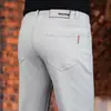 Calça Casual Masculina Bege de Alta Qualidade Italiana Outono 2026 Slim Fit Afunilada Versátil Elástica Calça Social