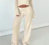 Conjunto Duas Peças Feminino para o Inverno 2026: Top Liso de Cor Profunda com Decote V e Amarração + Calça Reta com Cordão