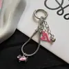 Colgante de salchicha en forma de corazón rosa pálido, dulce y fresco, cadena para teléfono de hueso de serpiente, llavero de dibujos animados lindo y charm para bolso