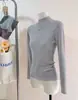 Camiseta Base de Punto con Cuello Alto y Hilo de Mecha para Mujer Otoño e Invierno 2026 Suéter con Cuello Alto y Hombro Normal