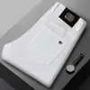 Novedad Otoño e Invierno 2025 Jeans Blancos de Moda de Marca Grande para Hombre Pantalones Elásticos Rectos Ajustados Versátiles para Hombre