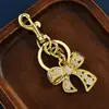 Venta Caliente Transfronteriza Colgante de Lazo con Circonita de Color Incrustada de Diamantes Colgante Arcoíris Cerradura de Bolso Llavero Colgante Lazo Colgante