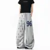 Pantalones de chándal casual retro estilo americano con estampado de estrellas y patchwork, pierna curva, unisex, colección primavera/otoño, corte holgado, pierna ancha, versátiles, pantalones hasta el suelo