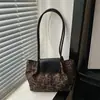 Nuevo bolso de hombro retro con textura de gamuza para mujer 2026, gran capacidad, versátil para el trabajo, elegante bolso cruzado y bolso de mano