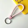 Llavero creativo de cuerda de cuero tejido a mano para pareja, llavero de coche, llavero al por mayor, colgante para bolso