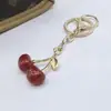Llavero de Cereza de Moda Retro Europeo y Americano Más Vendido Transfronterizo con un Toque de Alta Gama, Accesorio Colgante de Fruta de Cereza para Bolsa