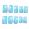 Manicura Navideña Europea y Americana Nueva Uñas Portátiles Azul Gradiente Simple Fresco Copo de Nieve Longitud Media Uñas Portátiles Venta al por Mayor