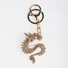 Llavero Creativo de Aleación del Zodiaco Dragón Chino Año del Dragón Dos Tonos Diamante Colgante para Bolso Venta Caliente Colgante para Coche Venta al por Mayor
