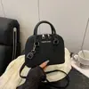 2025 Bolso con Forma de Concha de Cuadros Texturizados de Moda Versátil Popular Portátil Bolso Cruzado Informal de Hombro de Moda Portátil