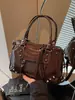 Bolsos transfronterizos 2026 otoño e invierno estilo motero vintage de gran capacidad bolso de mano bolso tote pequeño bolso cruzado de alta gama