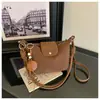 Bolso de mano tejido con patrón de moda transfronterizo, estilo nuevo, bolso tipo cubo de gran capacidad, elegante y versátil, se puede llevar bajo el brazo o como bolso de hombro