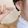 Pendientes de lujo ligeros de alta gama con piedra de ojo de gato para mujer, elegantes, con diseño de nicho, borlas largas y superllamativas, que combinan con todo.