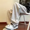 Nuevos pantalones rectos versátiles de otoño en stock para hombre, pantalones casuales deportivos holgados de moda para exteriores a rayas estilo americano