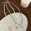 Elegante Temperamento Francés Diseño Simple Moño Perla Swarovski Collar Cadena Clavícula Moda de Alta Gama Lujo Ligero