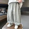 Calça de moletom infantil com estampa de cachorro para primavera e outono, novo estilo 2026, calça esportiva estilosa e solta para crianças, adequada para bebês e crianças maiores, calça de outono