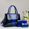 Conjunto de Bolsas Mãe e Filha Transfronteiriço, Bolsa de Mão Feminina Taizhou, Bolsa de Mão de Poliéster para Comércio Exterior, Bolsa Transversal de Ombro Único Estampada, Conjunto de Três Peças