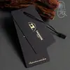 Produção de etiquetas de roupa, etiqueta de marca de roupa, personalização de logotipo, impressão e design de etiqueta de etiqueta estampada a quente em cartão preto de alta qualidade