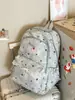 Mochila escolar para estudiantes de secundaria femeninas, mochila decorativa con adornos de encaje para niñas, bolsa ligera casual de doble hombro, protectora de la columna vertebral y reductora de carga