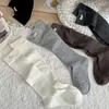 Calcetines altos de algodón para mujer, estilo coreano, con estampado de letras, simples, adelgazantes, transpirables, para primavera y otoño.