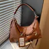 Nueva bolsa de hombro para axilas de diseño de nicho versátil de moda transfronteriza, bolsa cruzada de alta gama de gran capacidad, bolsa de albóndigas para commuter