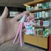 Llavero de cachorro de mascota lindo de dibujos animados, adorable colgante para bolso de perro mascota, decoración de mochila para estudiante, venta al por mayor de regalos pequeños