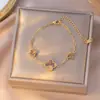 Collar Popular Transfronterizo de Trébol de Cuatro Hojas de Acero de Titanio para Niñas, Lujo Ligero y Versátil Nuevo Conjunto de Cadena Clavicular de Cinco Flores de Doble Cara
