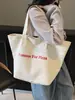 Bolso de Hombro de Lona Estilo Casual y Relajado para Mujer 2026 Nuevo Versátil Gran Capacidad Bolsa de Compras para Estudiantes Bolso Tote para Viajes Diarios